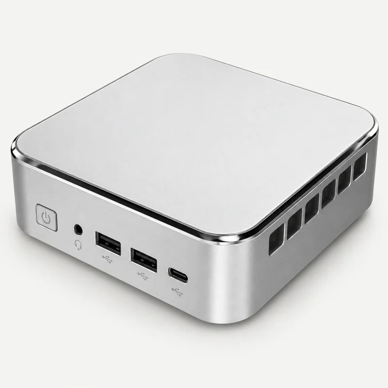 Silver compact mini PC with glossy edge trim on a light studio background