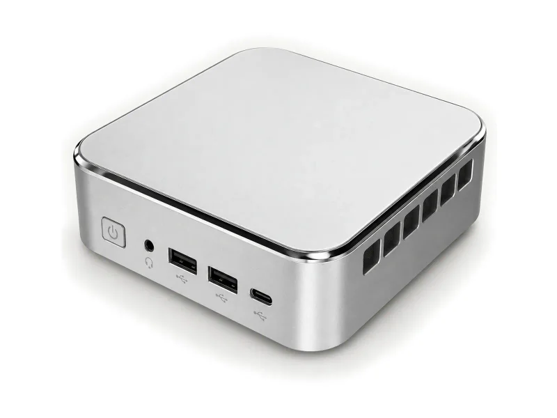Silver compact mini PC with glossy edge trim on a light studio background