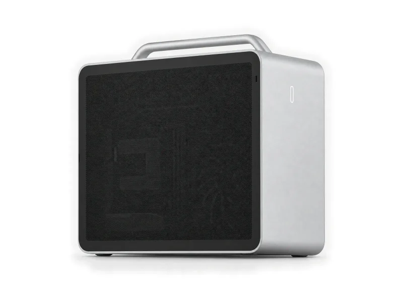 Silver workstation with a carry handle and a black mesh side panel on a light studio background