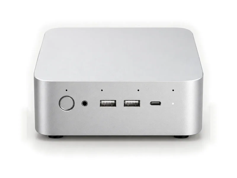 Silver square mini PC on a light studio background
