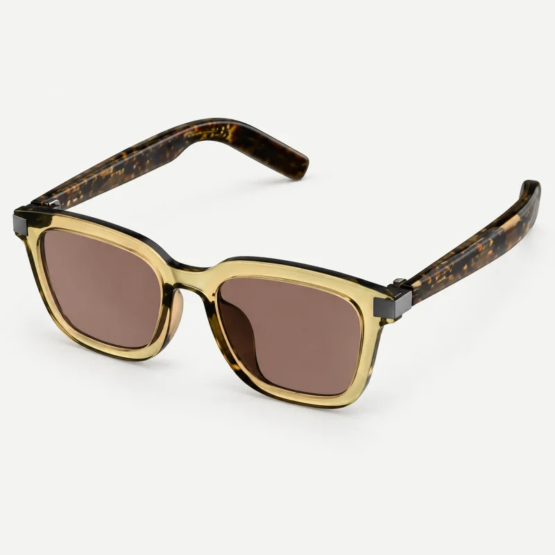 Champagne-frame smart sunglasses with brown lenses and tortoiseshell temples on a light studio background