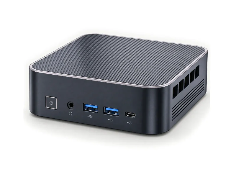 Dark graphite mini PC with finely lined top on a light studio background